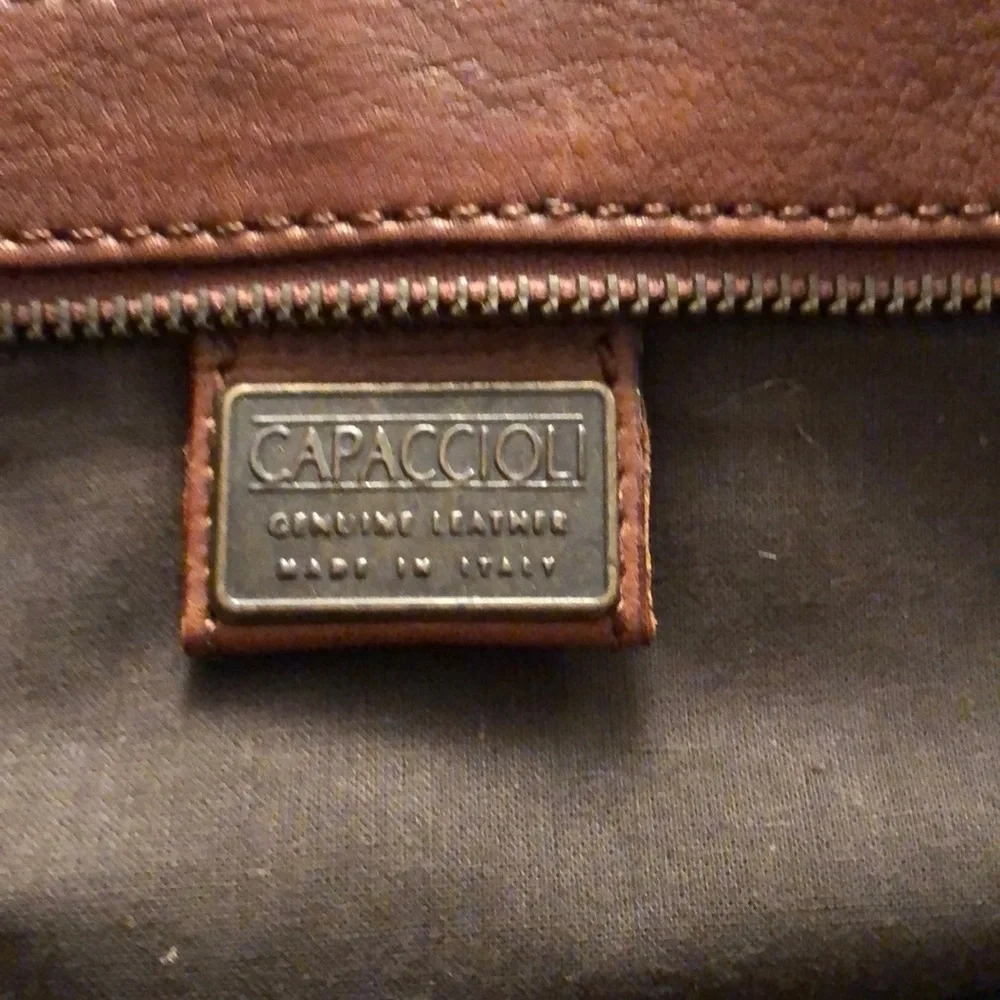 Capacciou large brown Leather bag  side zip pockets 2  long leather tassels